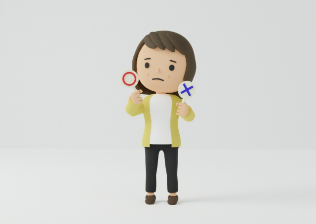 丸かバツか悩んでいる人形